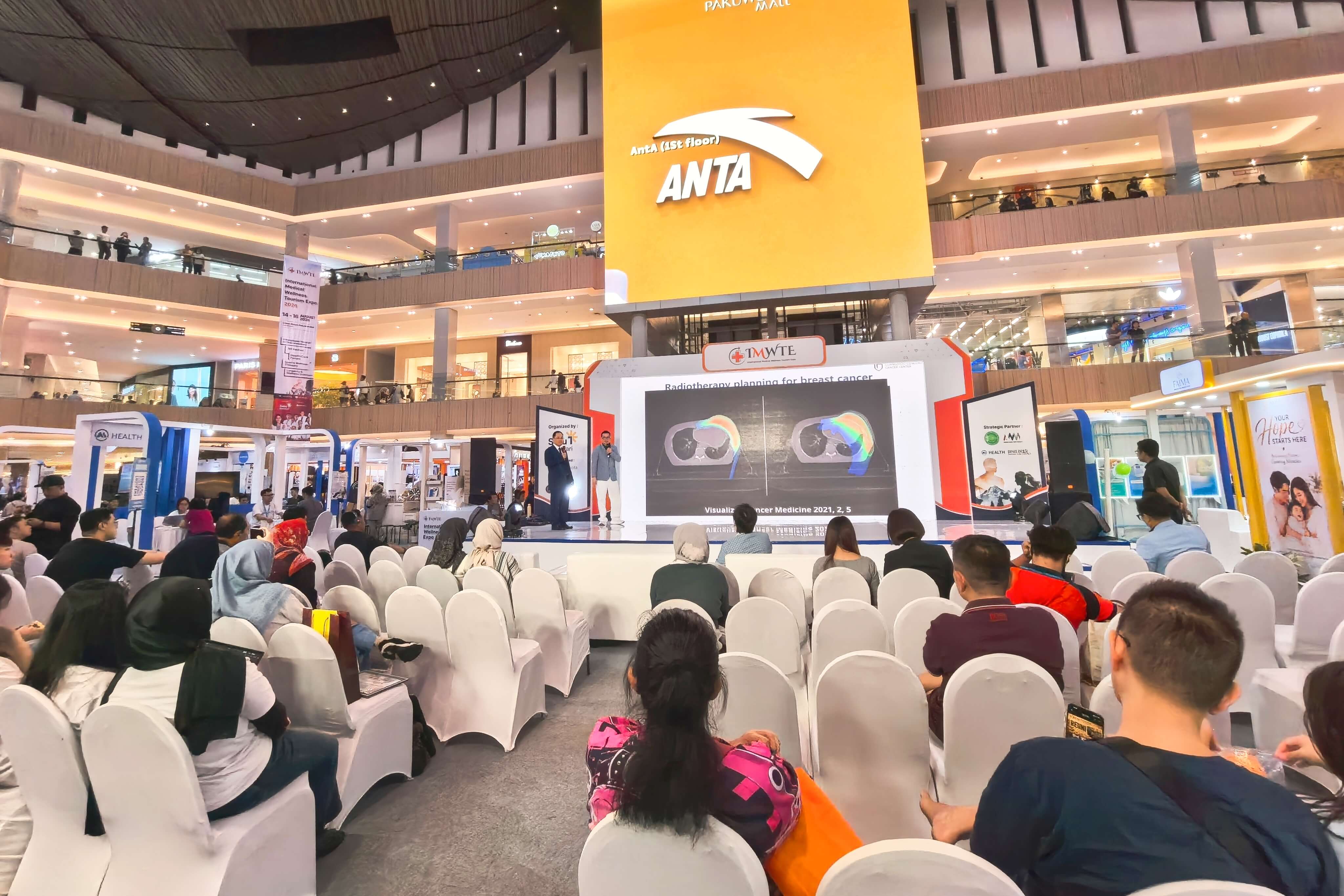 The GCCC team at the Surabaya International Health and Medical Expo (IMWTE 2026) — radiotherapy lecture in progress