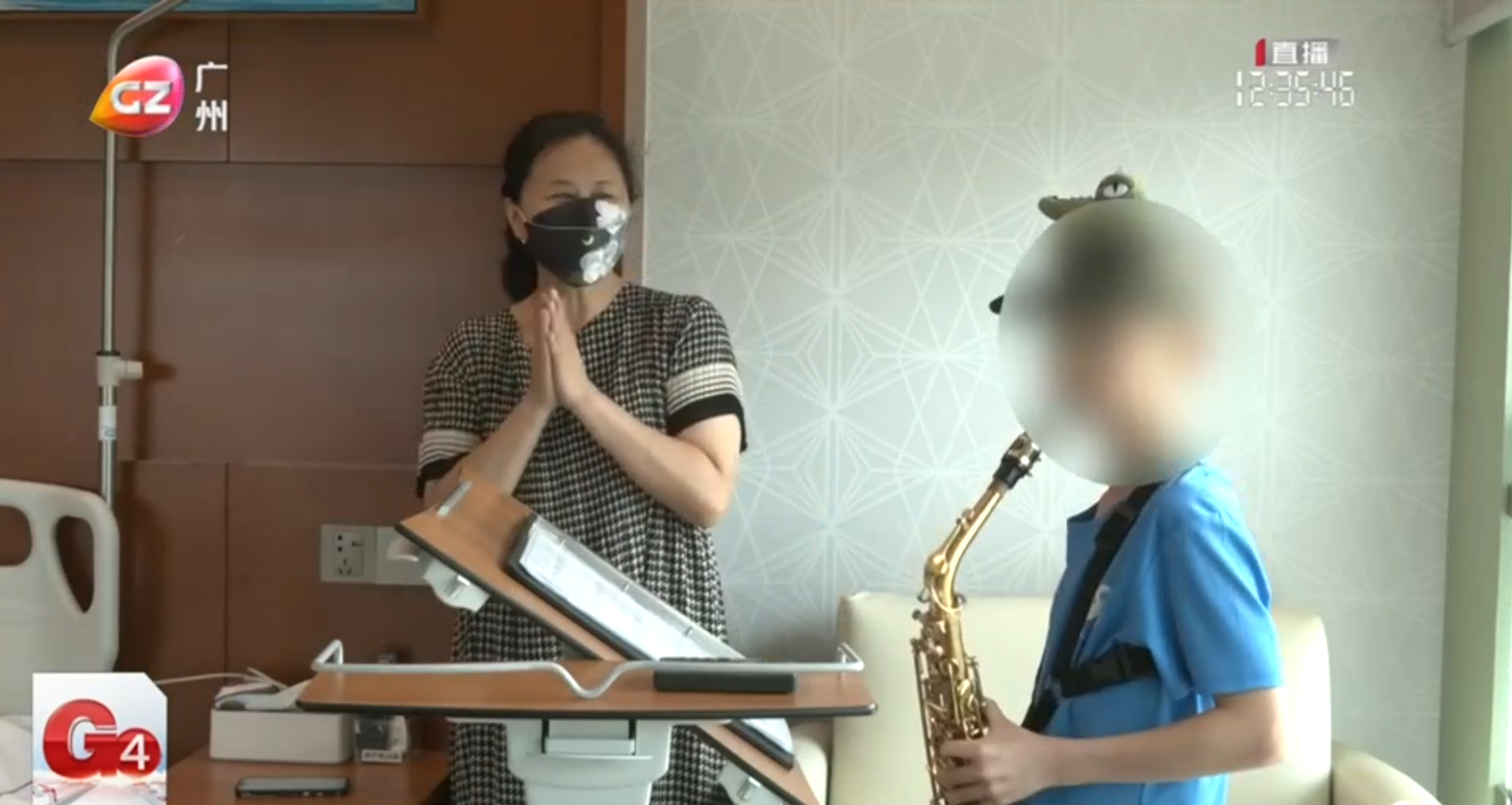 The 9-year-old patient with his saxophone, looking forward to returning to school